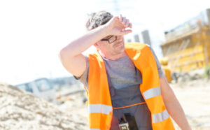 Construction Worker Suffering from Sun Heat